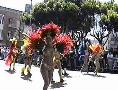 Dancers wearing golden outfits.